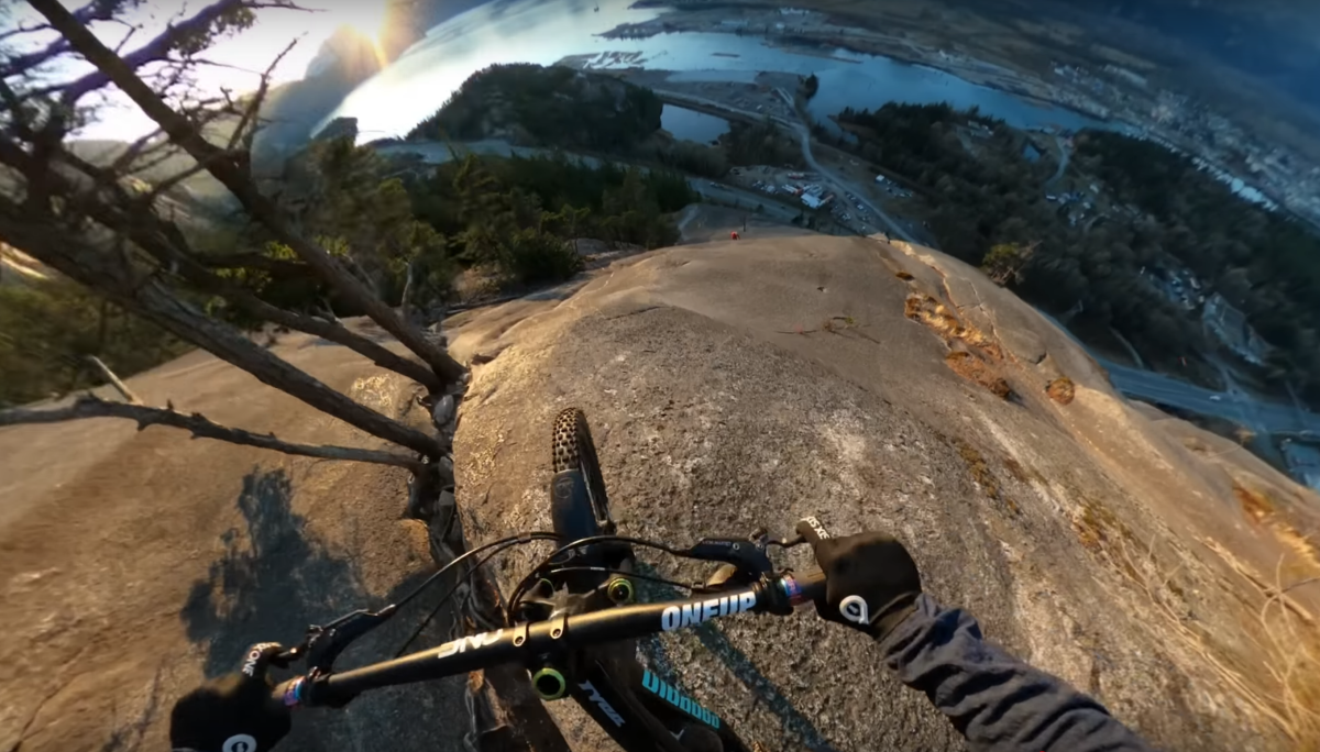 look-mountain-biker-rides-near-vertical-rock-face-bikemag